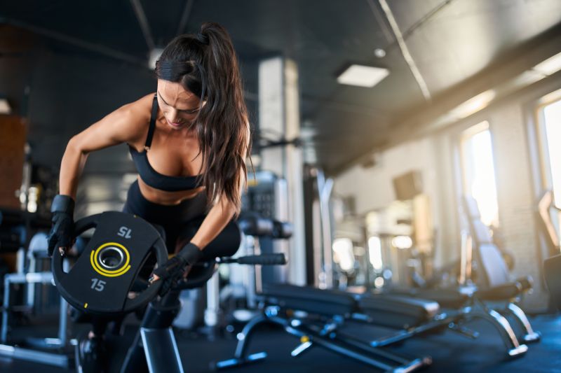 Woman Doing Hyperextension Exercise In Gym Tecnirunner 1252